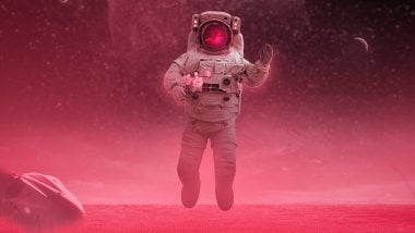 Astronaut floating in space Wallpaper
